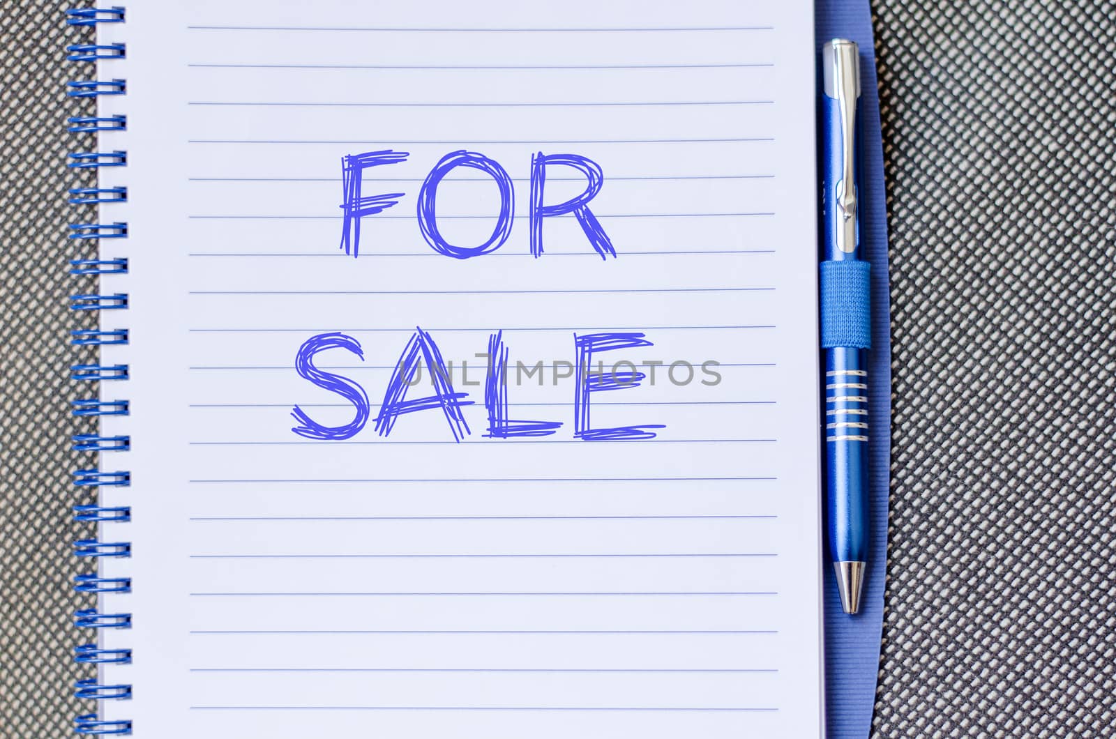 For sale text concept write on notebook with pen