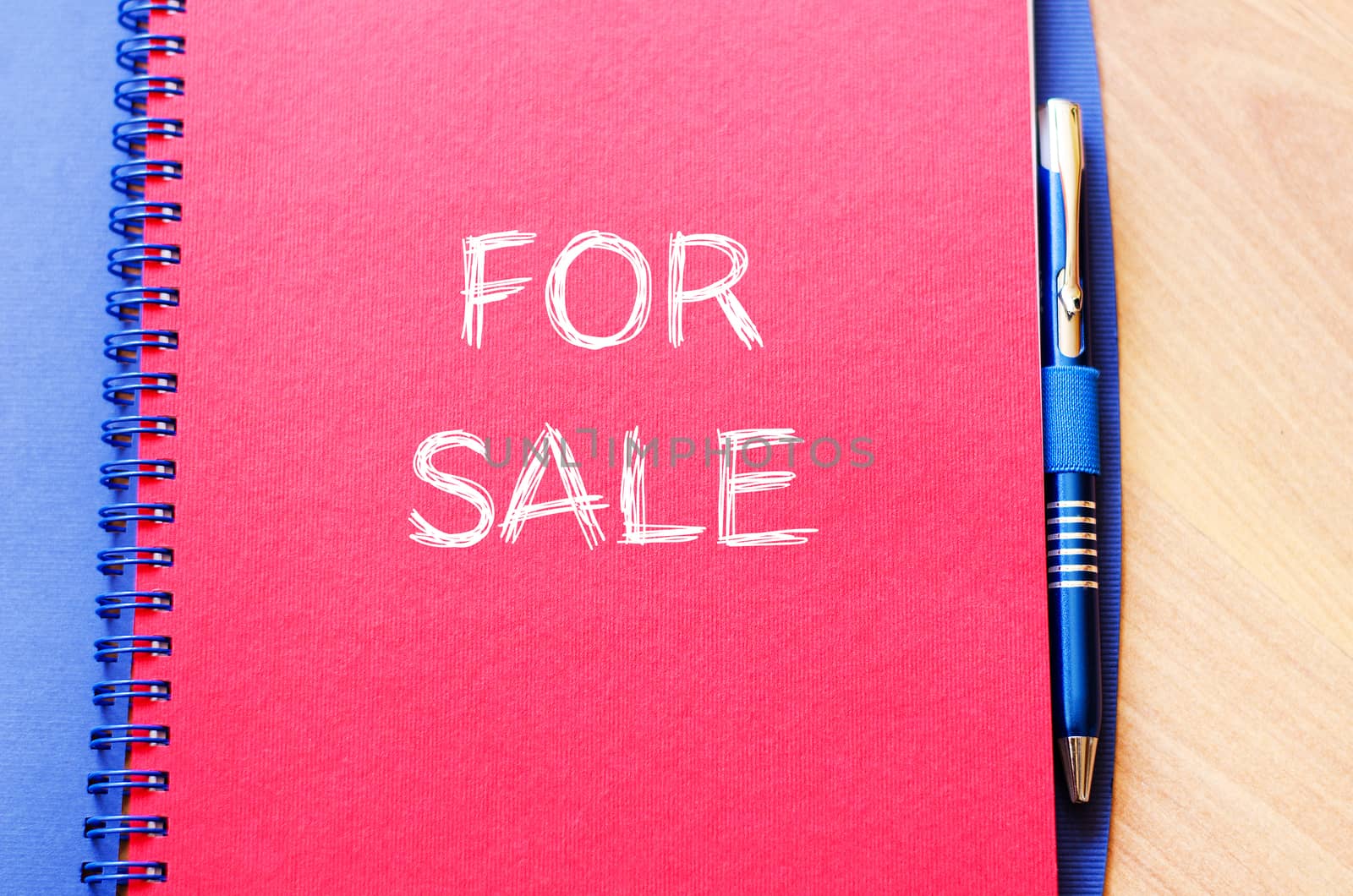 For sale text concept write on notebook with pen