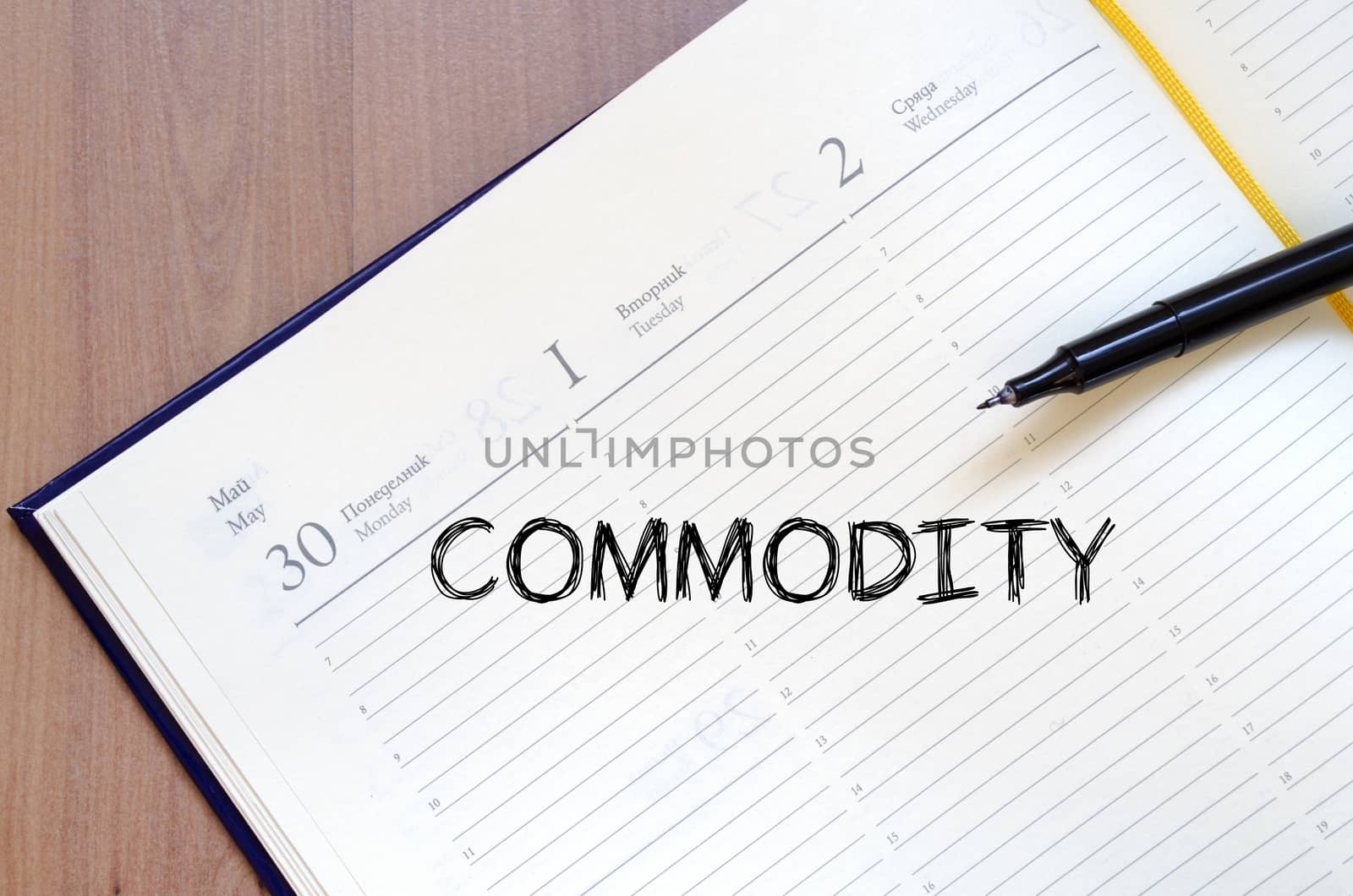 Commodity text concept write on notebook with pen