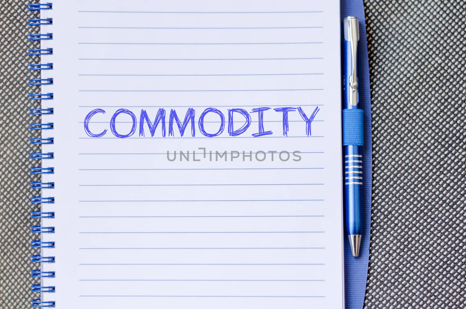 Commodity text concept write on notebook with pen