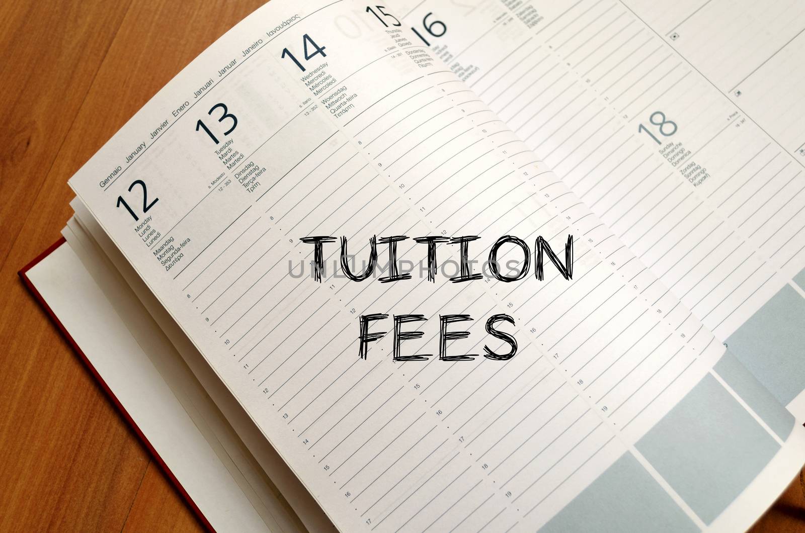 Tuition fees text concept write on notebook with pen
