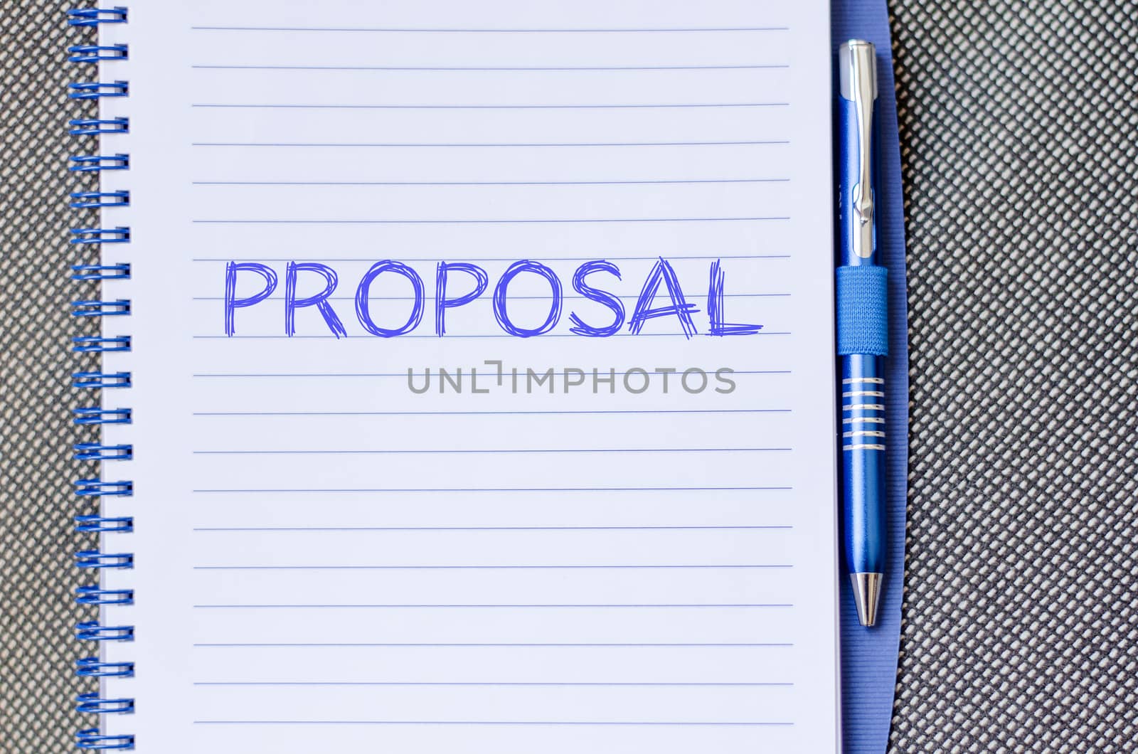 Proposal text concept write on notebook with pen