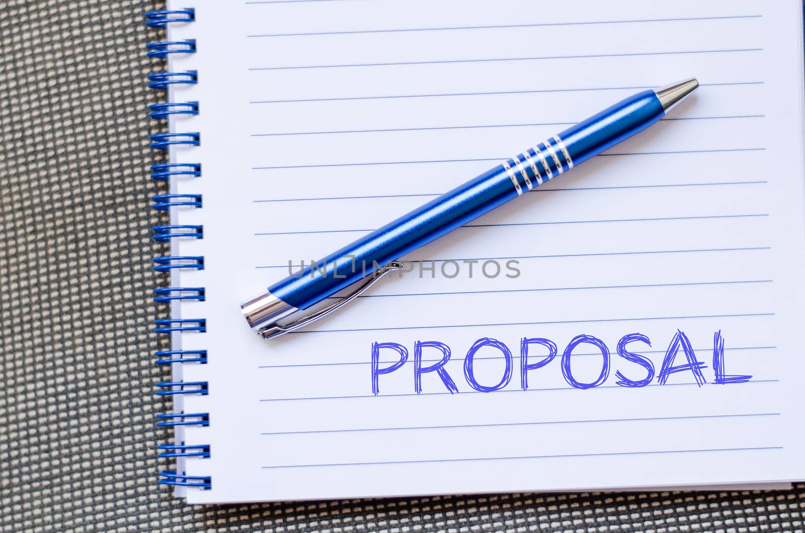 Proposal text concept write on notebook with pen
