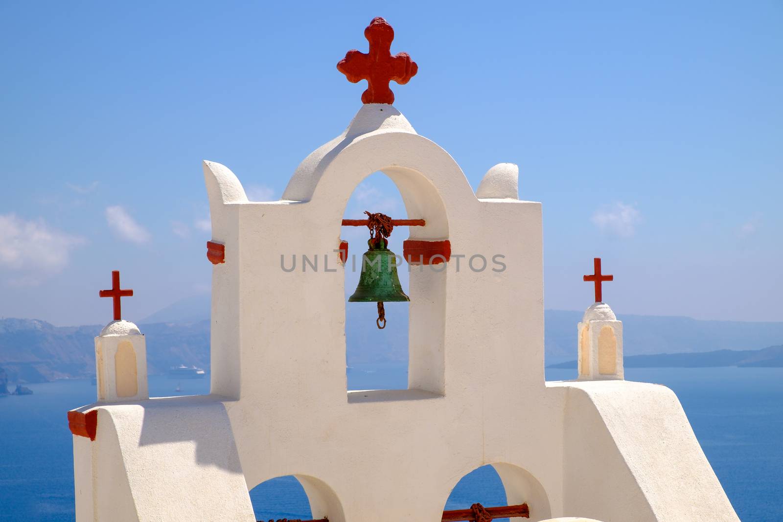 Detail of bell and crosses on traditional cycladic church, Santorini, Greece