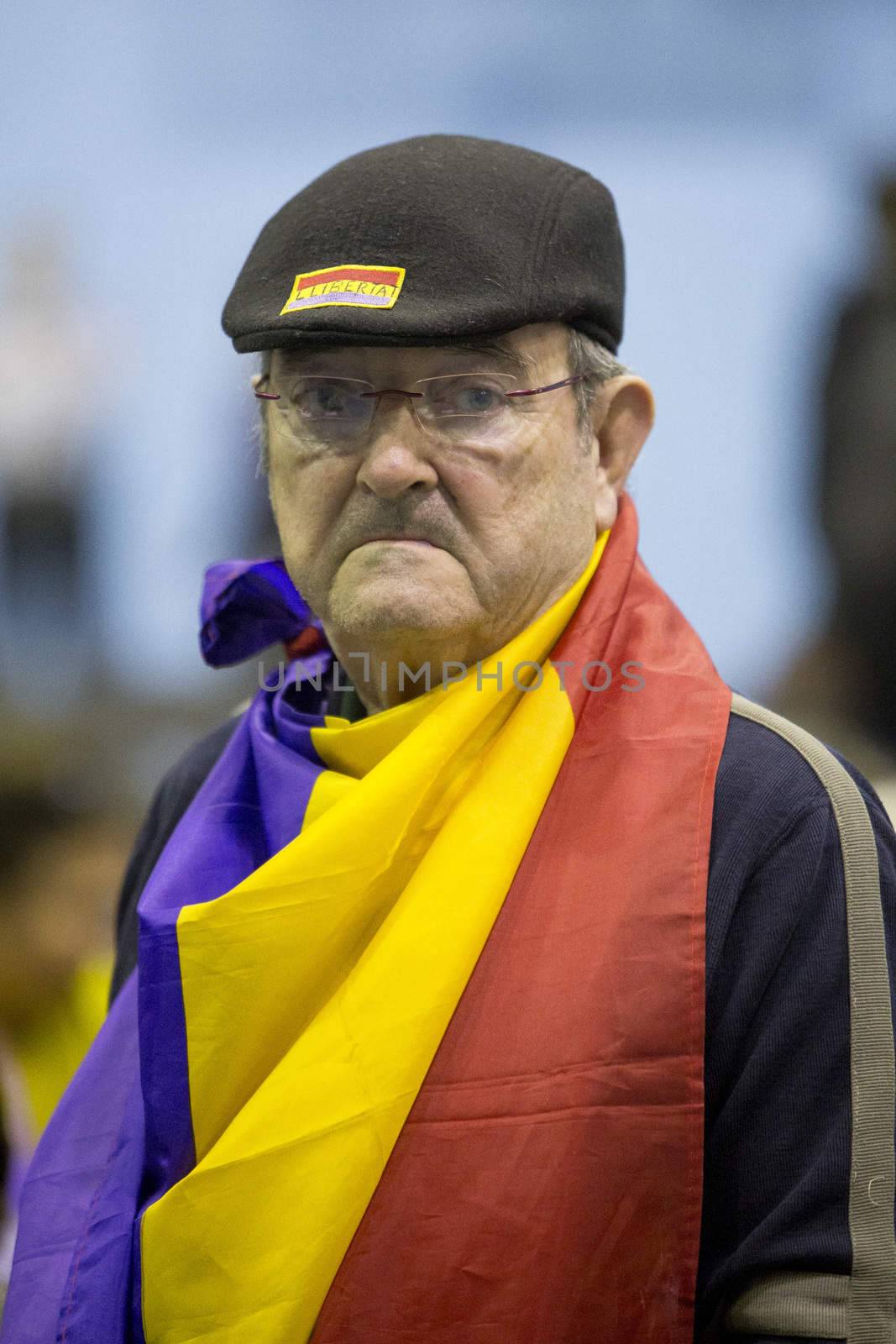 SPAIN, Barcelona: A supporter of the electoral coalition En Comu Podem (Together We Can) attends a campaign meeting at Hospitalet de Llobregat near Barcelona, Spain on December 5, 2015. Spain's general election takes place on December 20.
