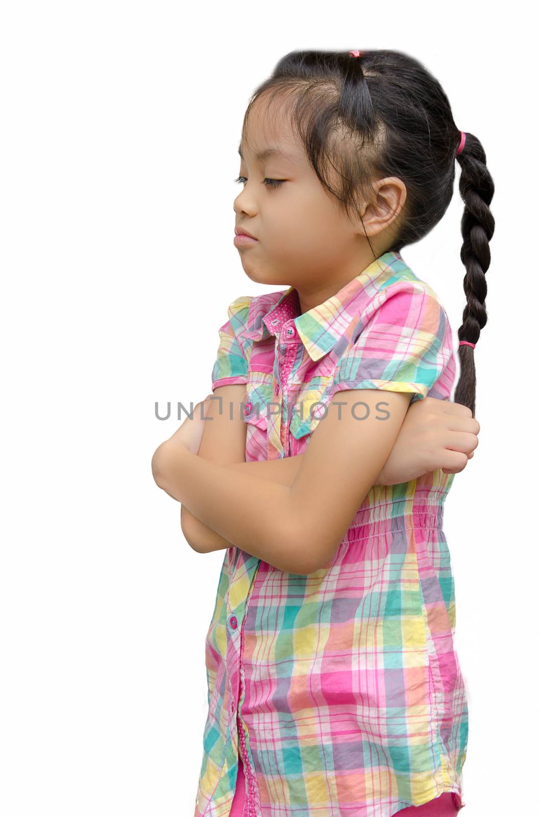 Angry little girl on the white background.