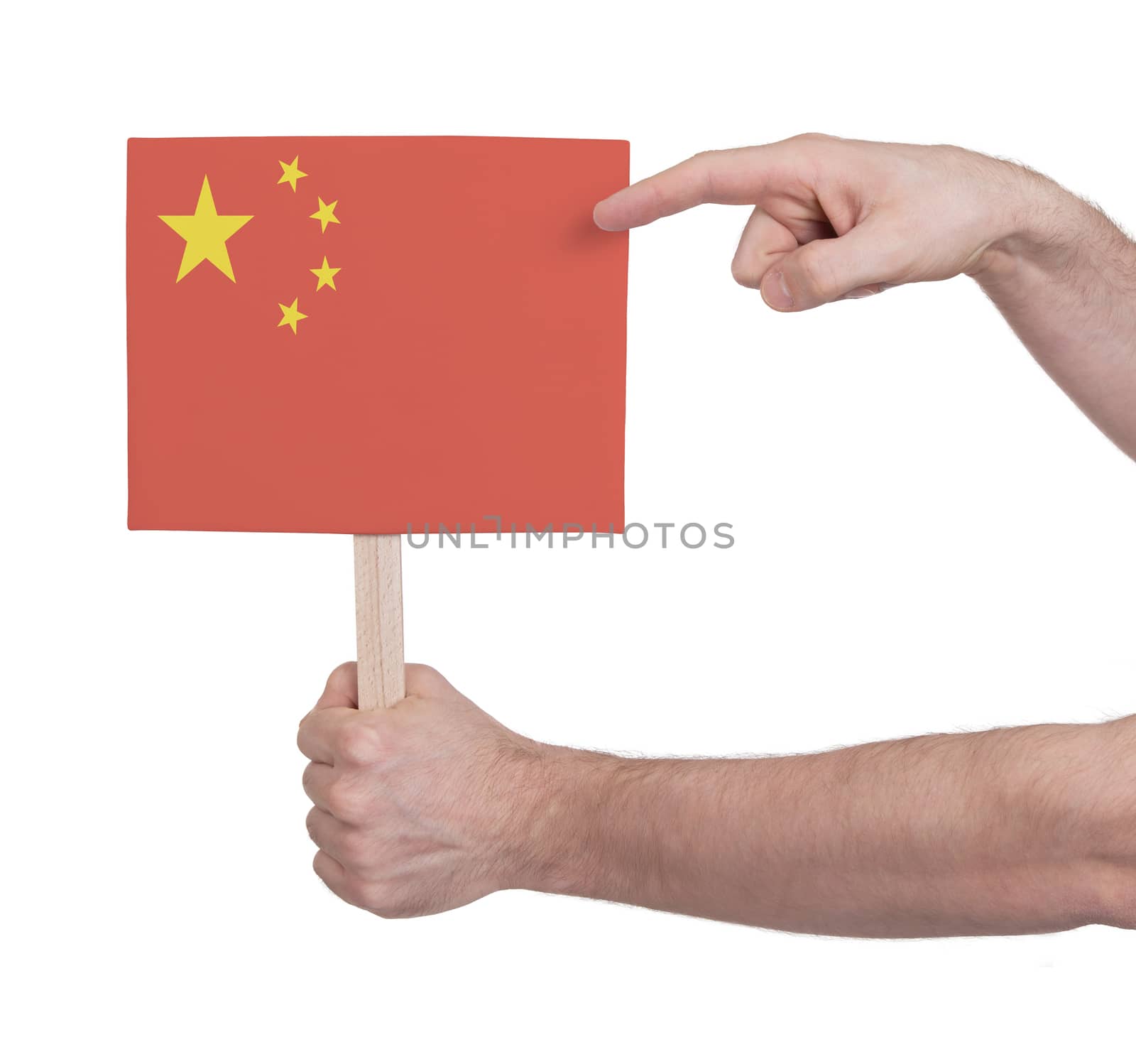 Hand holding small card, isolated on white - Flag of China