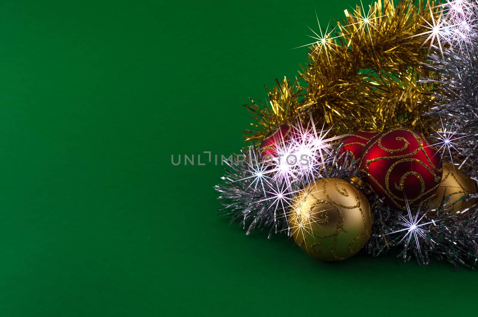 Christmas decoration, red gold and silver, on green background