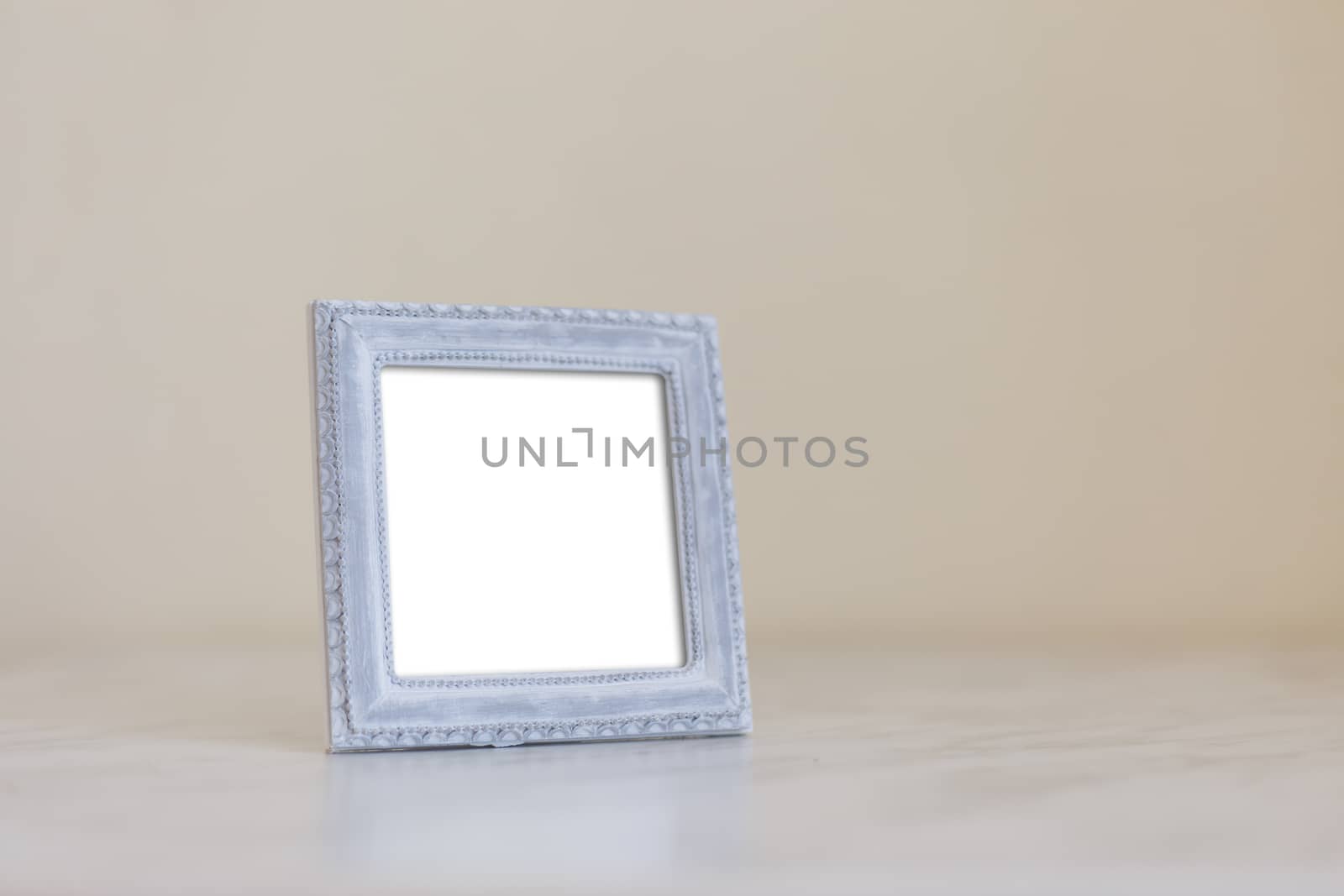 Close up detailed front view of white blank wooden frame with copy space.
