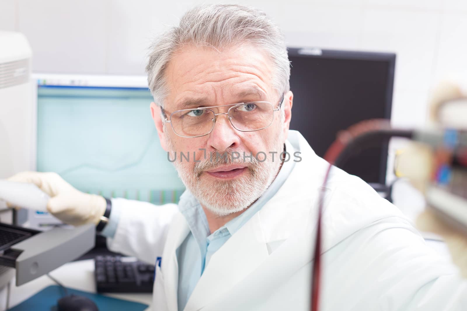 Life science researcher  performing a genotyping testing which enables personalized medicine. PM is a medical model that proposes the customization of healthcare.