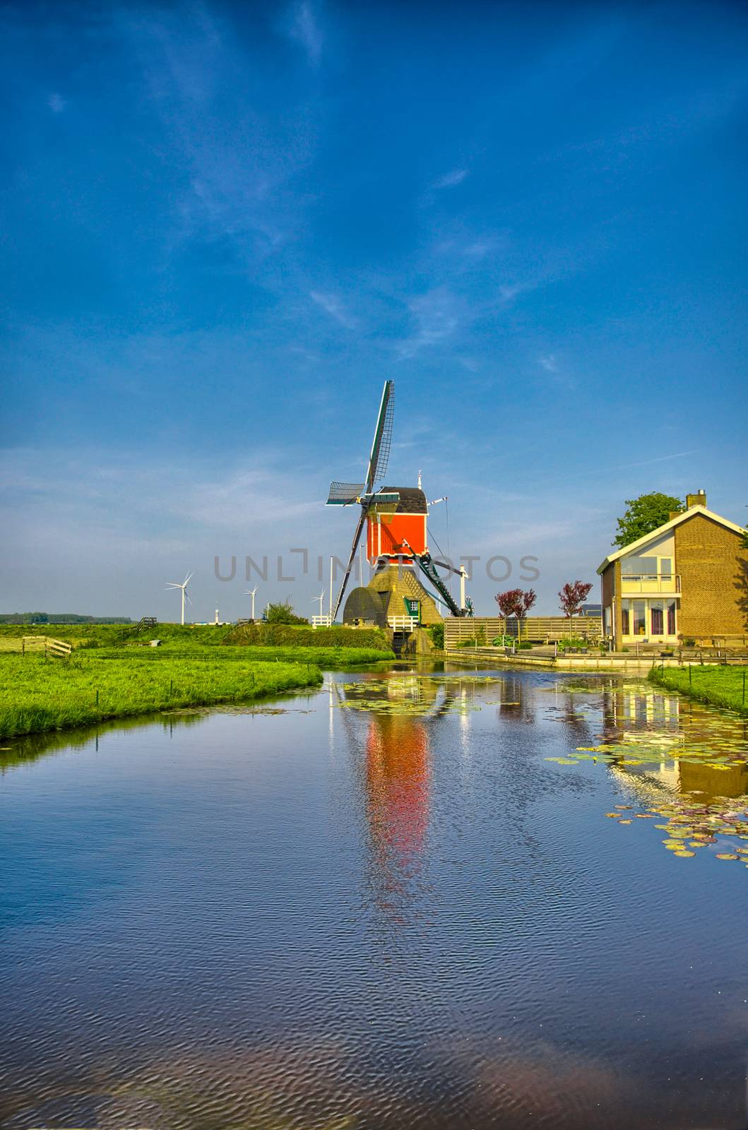 Windmills and water canal in Kinderdijk, Holland or Netherlands. Unesco world heritage site. Europe. HDR