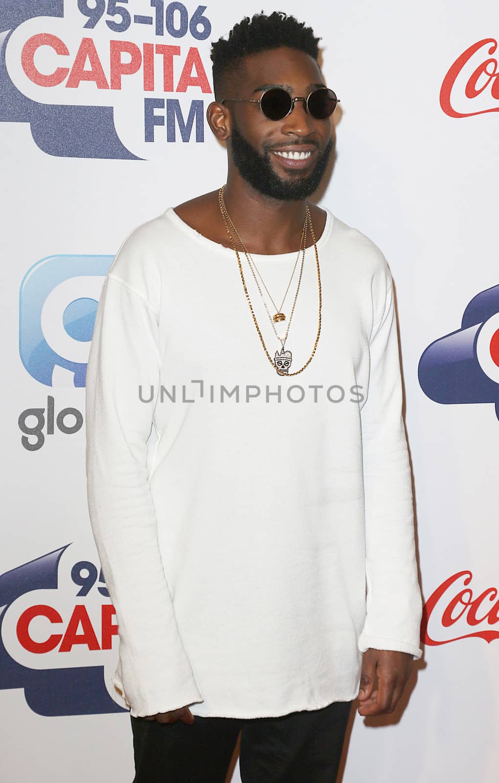 UNITED KINGDOM, London: Tinie Tempah arrives to the O2 stadium ahead of Capital's Jingle Bell Ball on December 5, 2015.  The event shares a portion of the ticket sales profit with Global's Make Some Noise charity.  Stars in the photos include: David Guetta, F leur East, Jason Derulo,  Katy B, Marvin Humes, Nathan Sykes, Tinie Tempah, WSTRN, and Years and Years.      