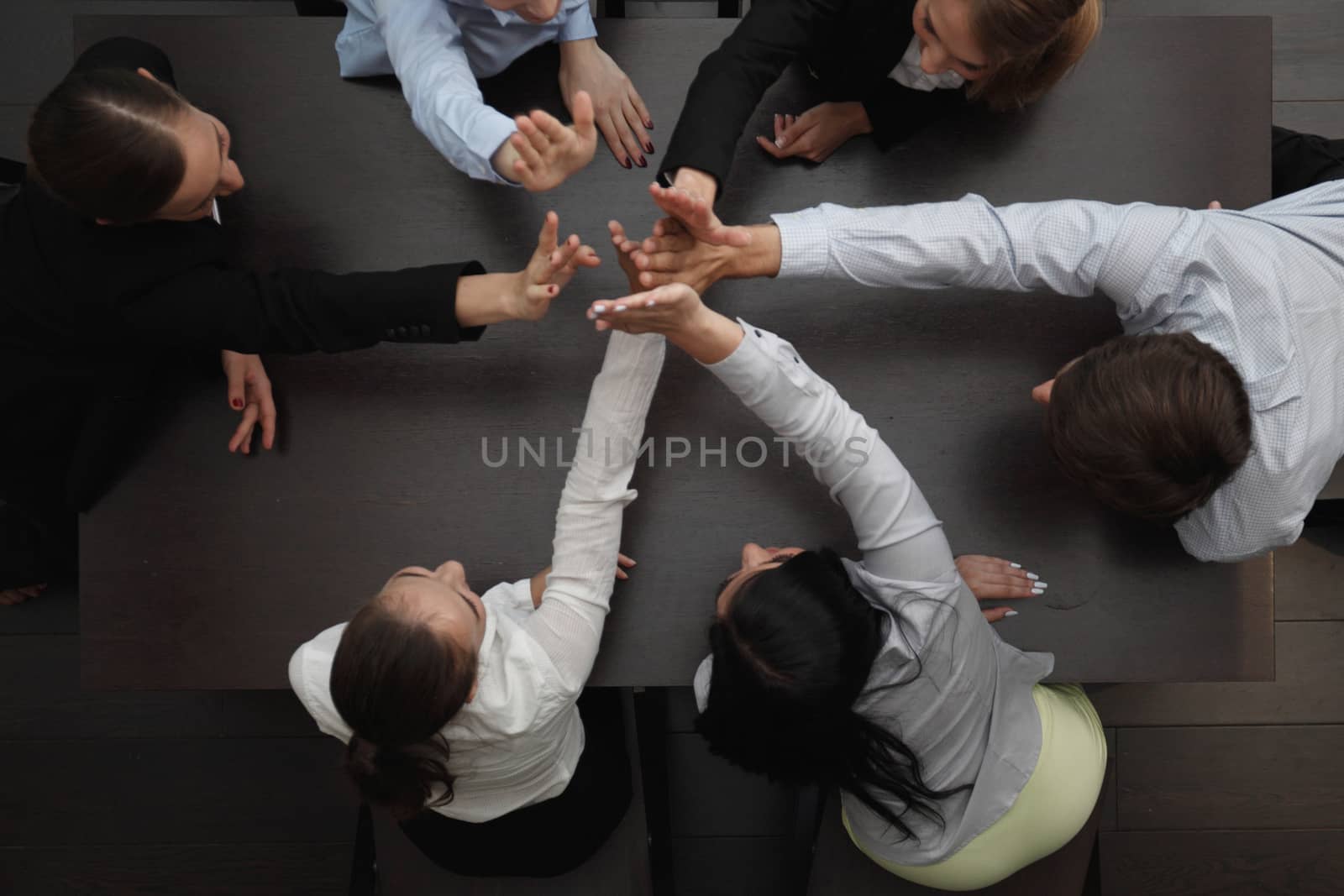 People with their hands together by ALotOfPeople