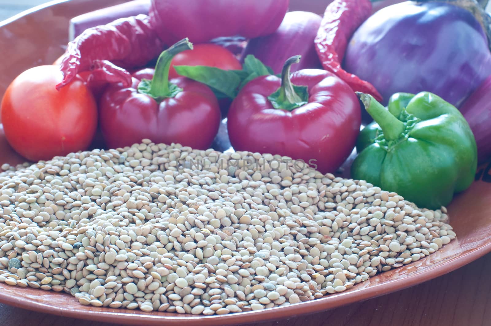 Lentils ready to be cooked with tomatoes , peppers , eggplant by gringox
