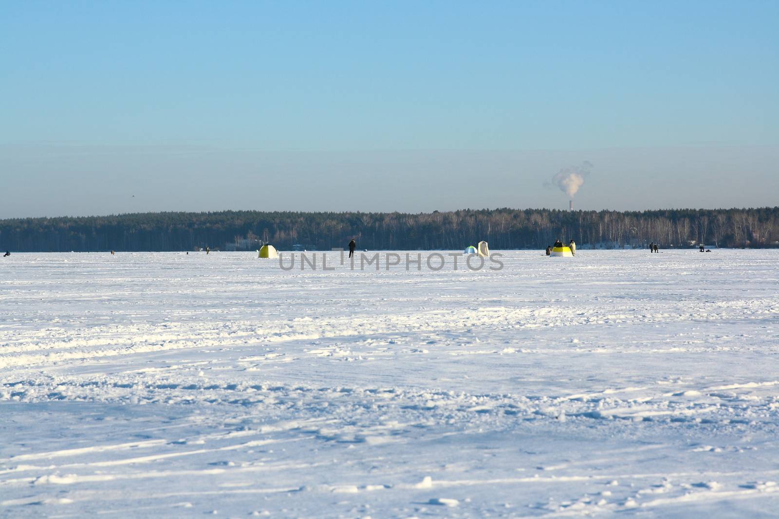 Fishermans on ice for fishing by mturhanlar