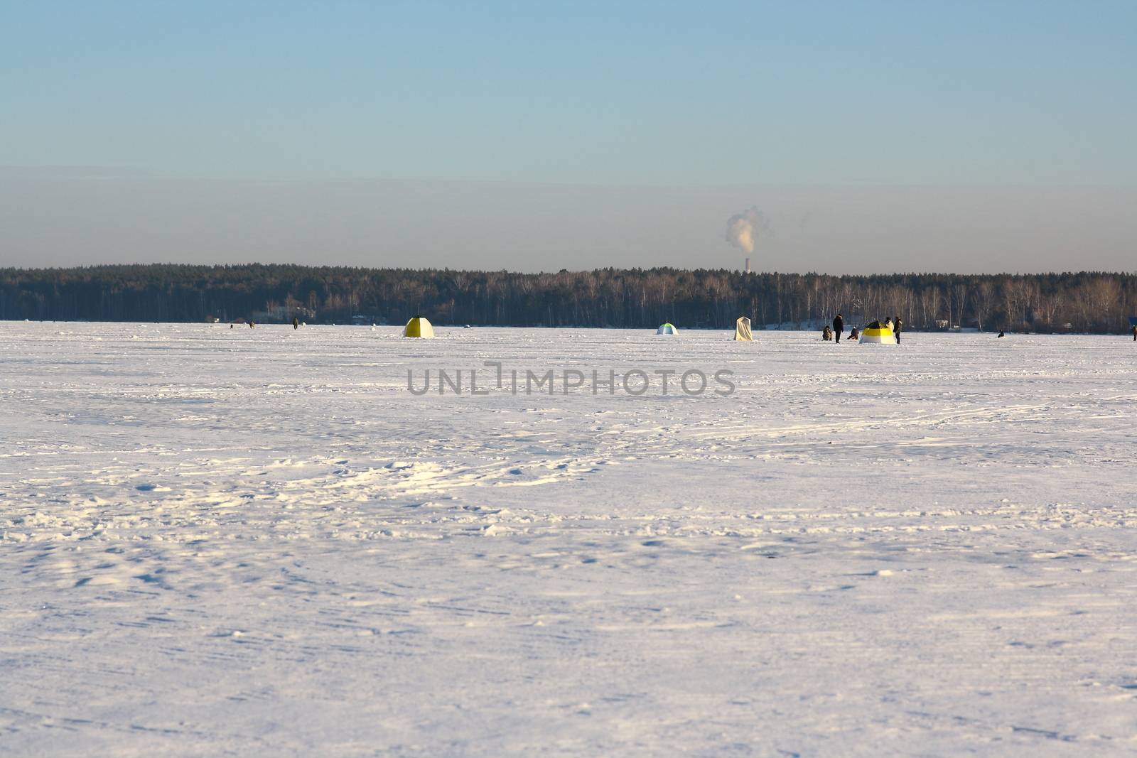 Fishermans on ice for fishing by mturhanlar