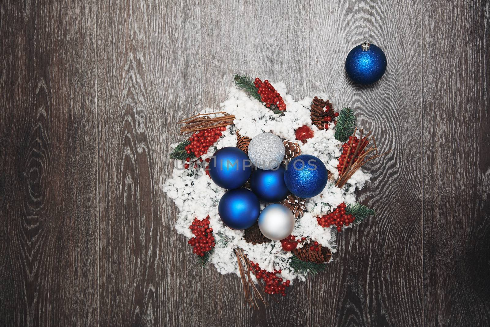 Christmas wreath and toys on a hardwood background