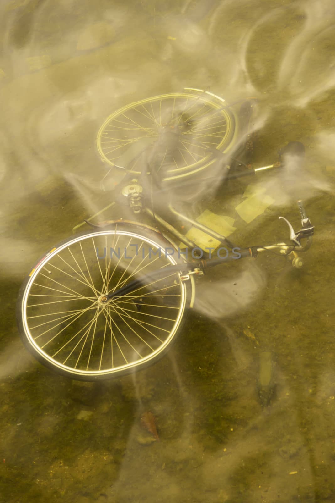 Abandoned bicycle on the bottom of a canal in the city of Copenhagen in Denmark.
