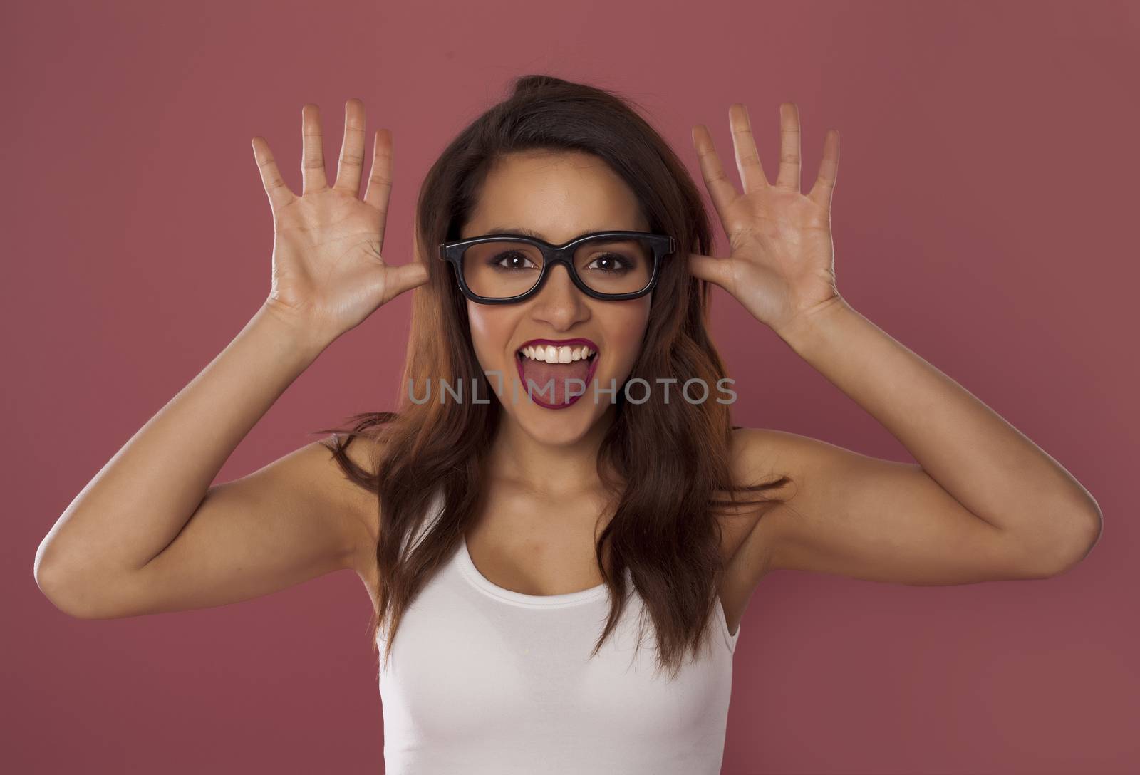 Beautiful model over pink background.