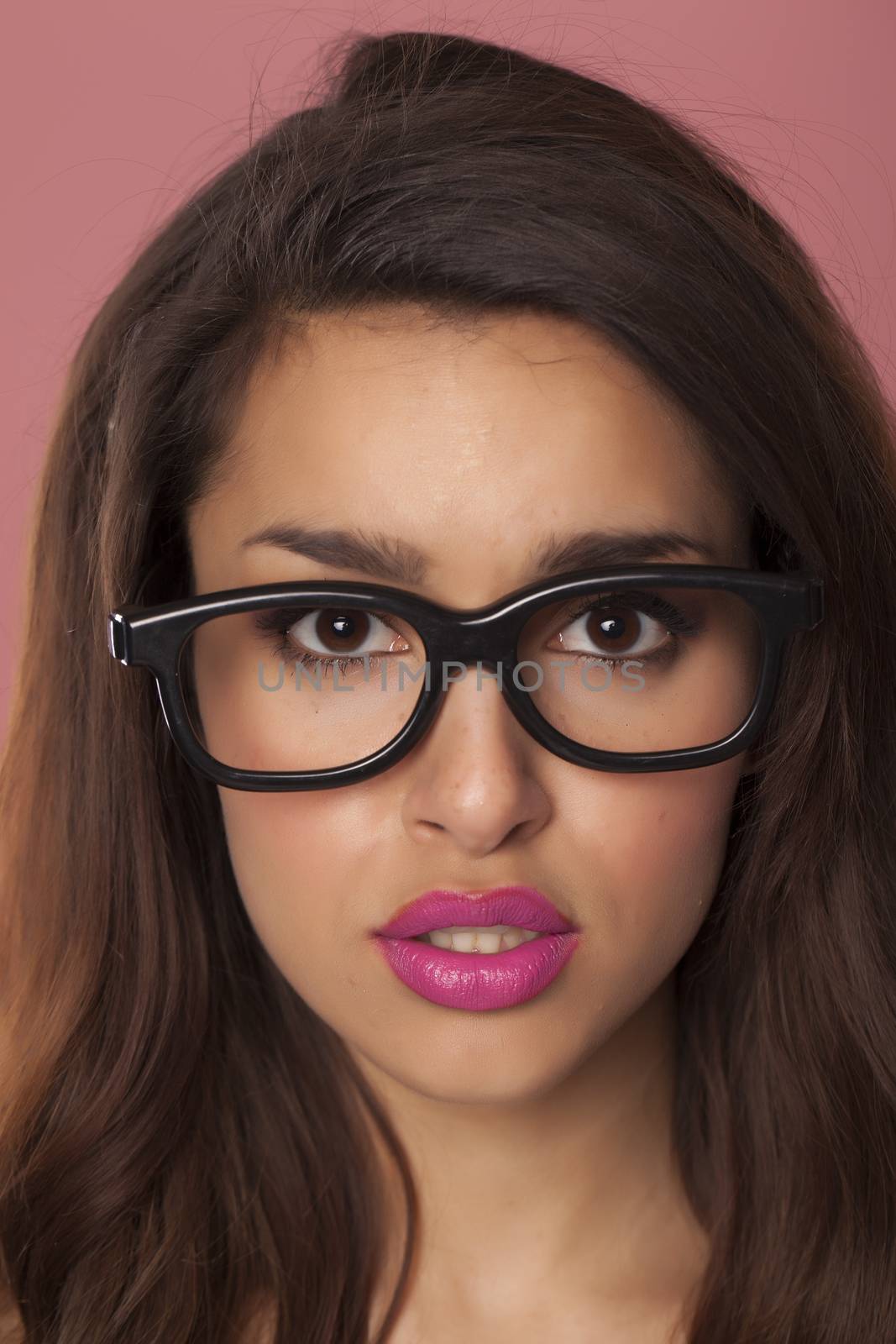 Beautiful model over pink background.