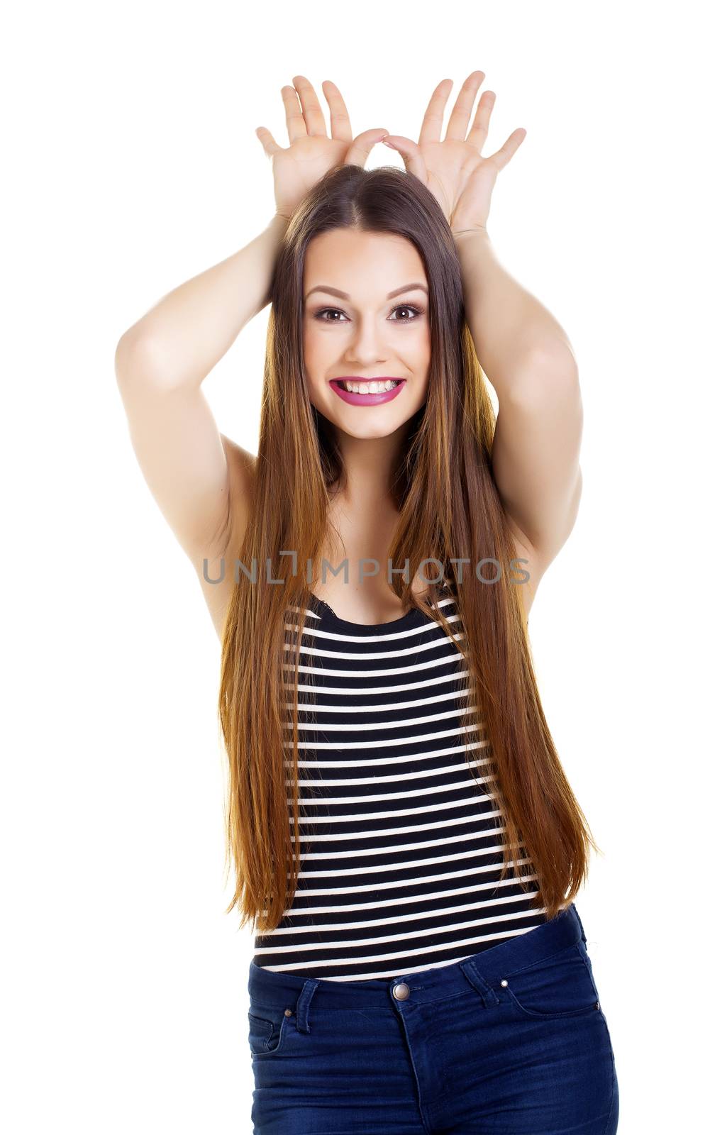 Casual young woman over a white background.