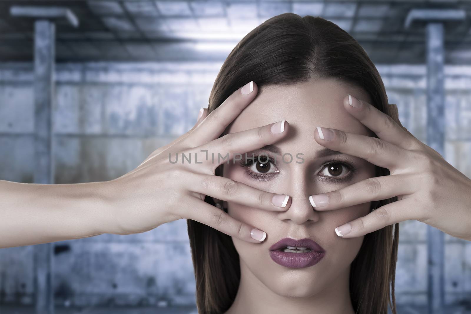 Beautiful portrait of a young woman over a grunge background.