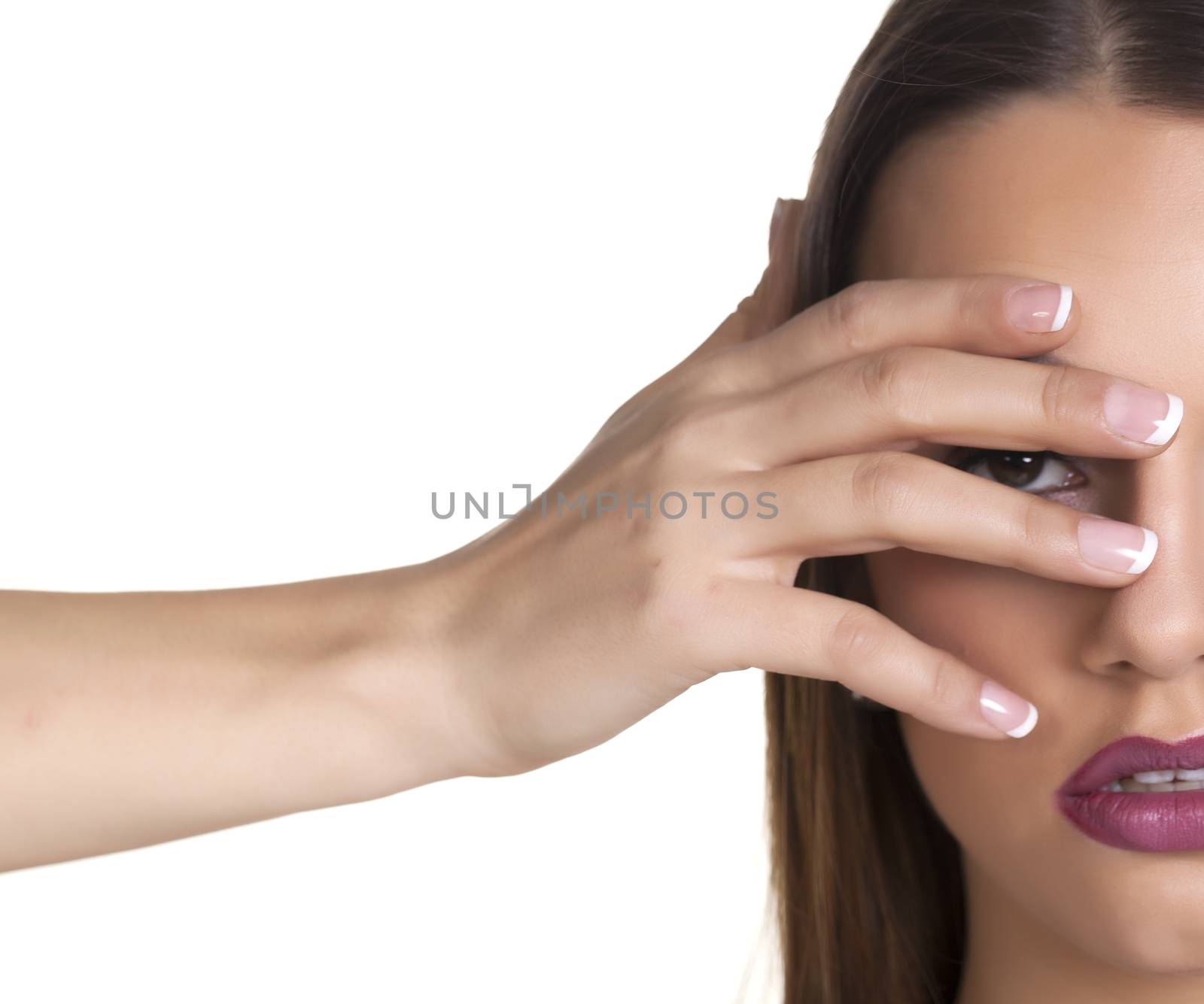 Beautiful brunet woman over a white background.