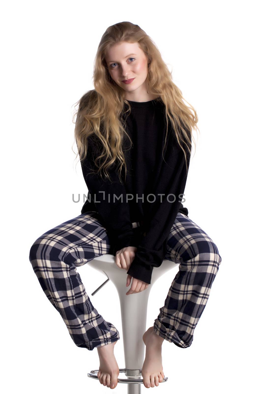 Fashionable blond woman over a white background.