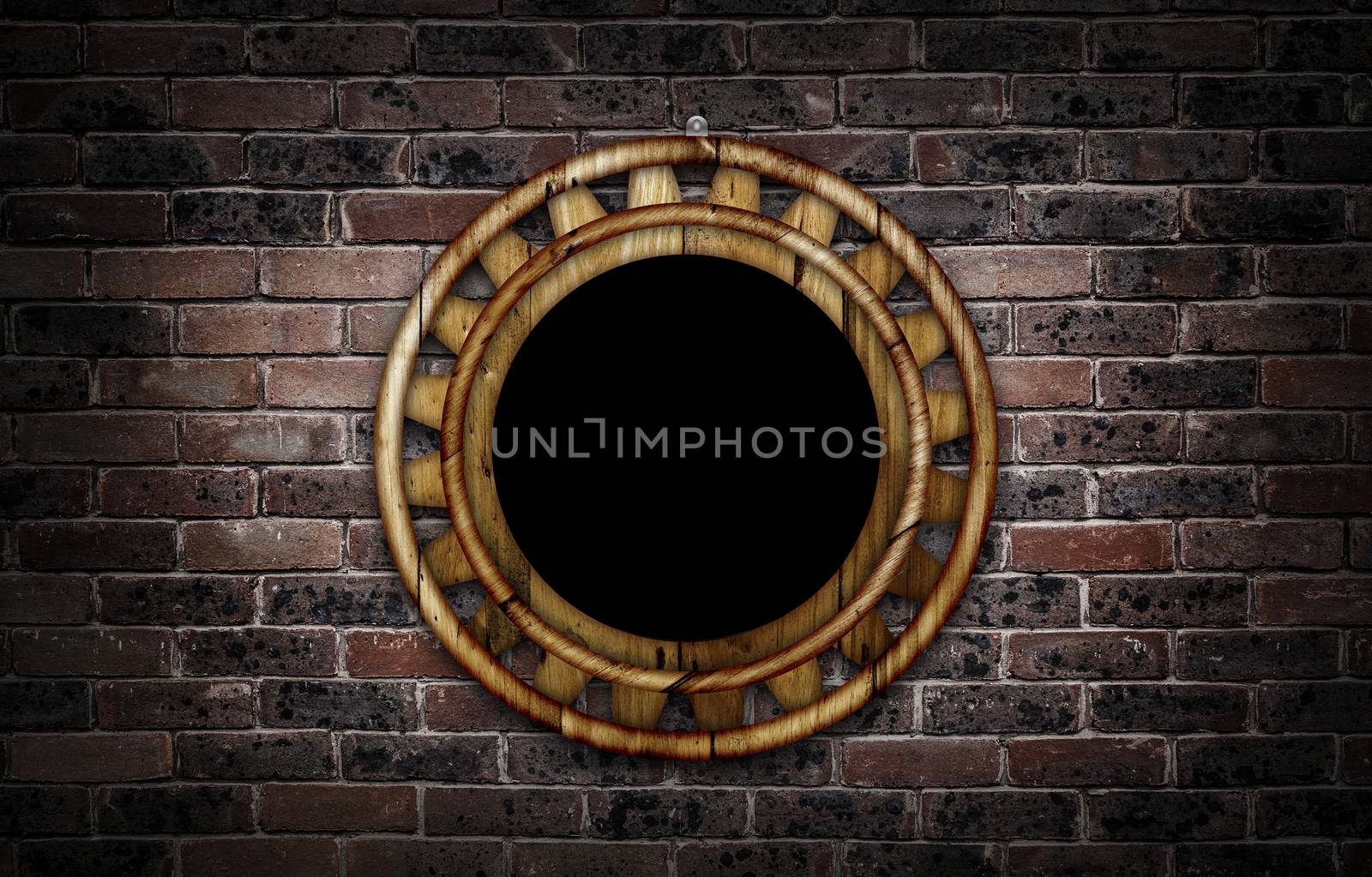 Wooden round frame against a brick wall with copy space in the centre.