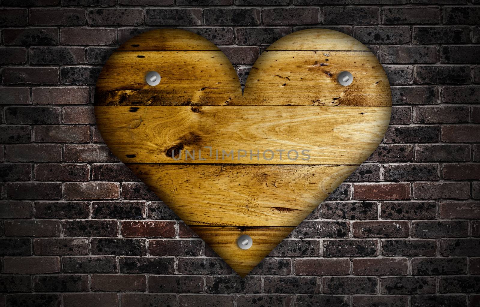 Wooden heart over a brick wall.