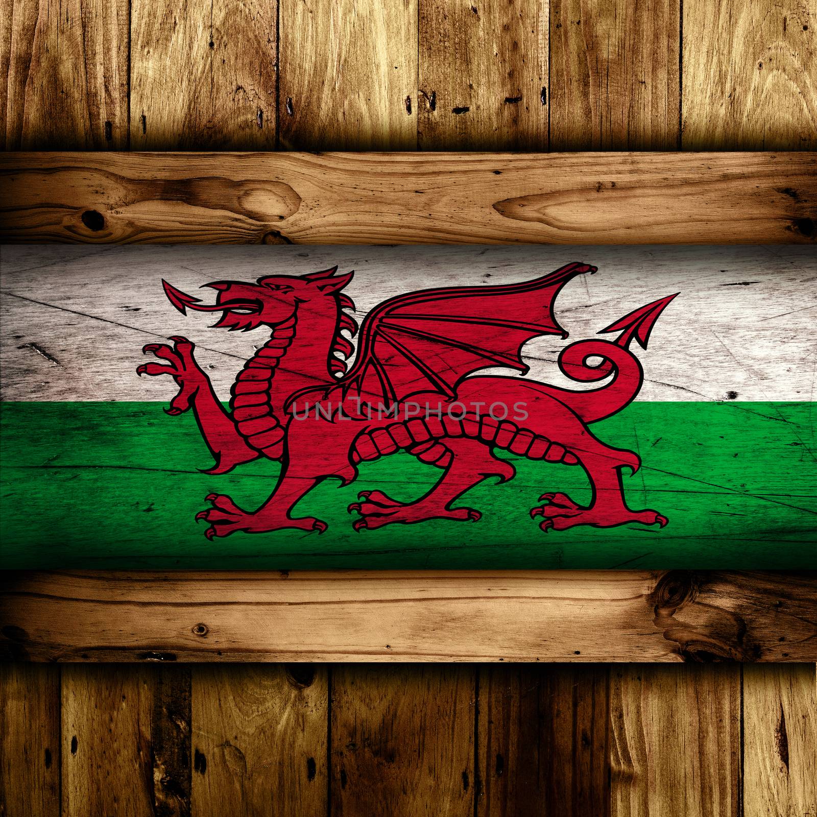 Abstract Welsh flag over a wooden background.