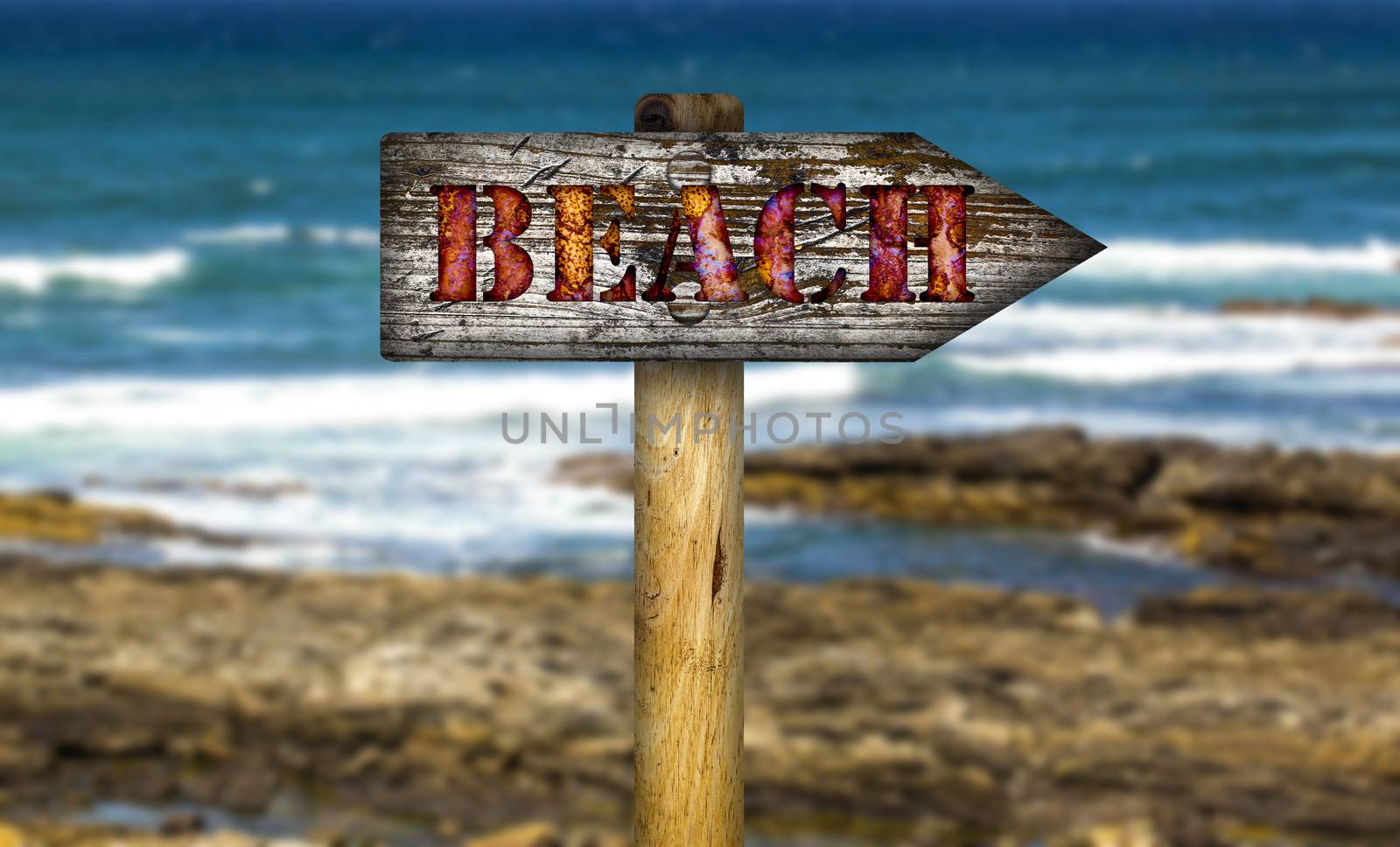 Worn wooden beach sign.