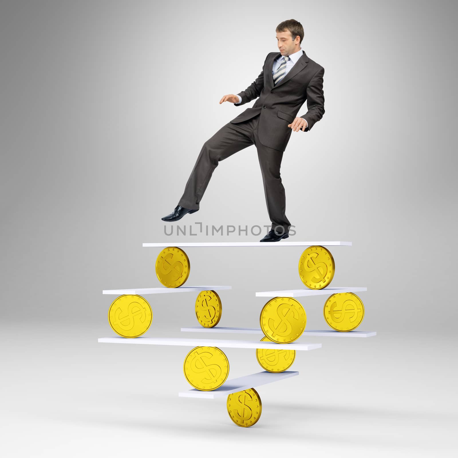 Businessman standing on balance with gold coins and looking down