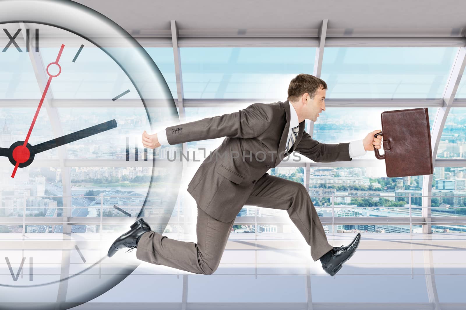 Businessman running with clock in building, abstract background