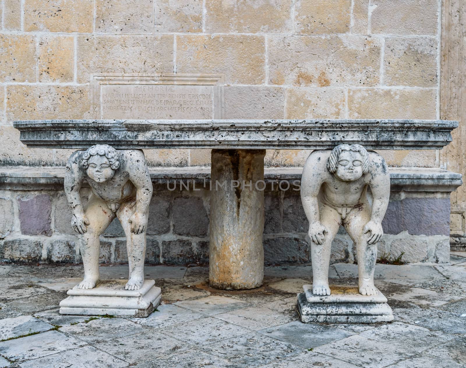 Stone table, which stands on two carved titans, Perast by radzonimo