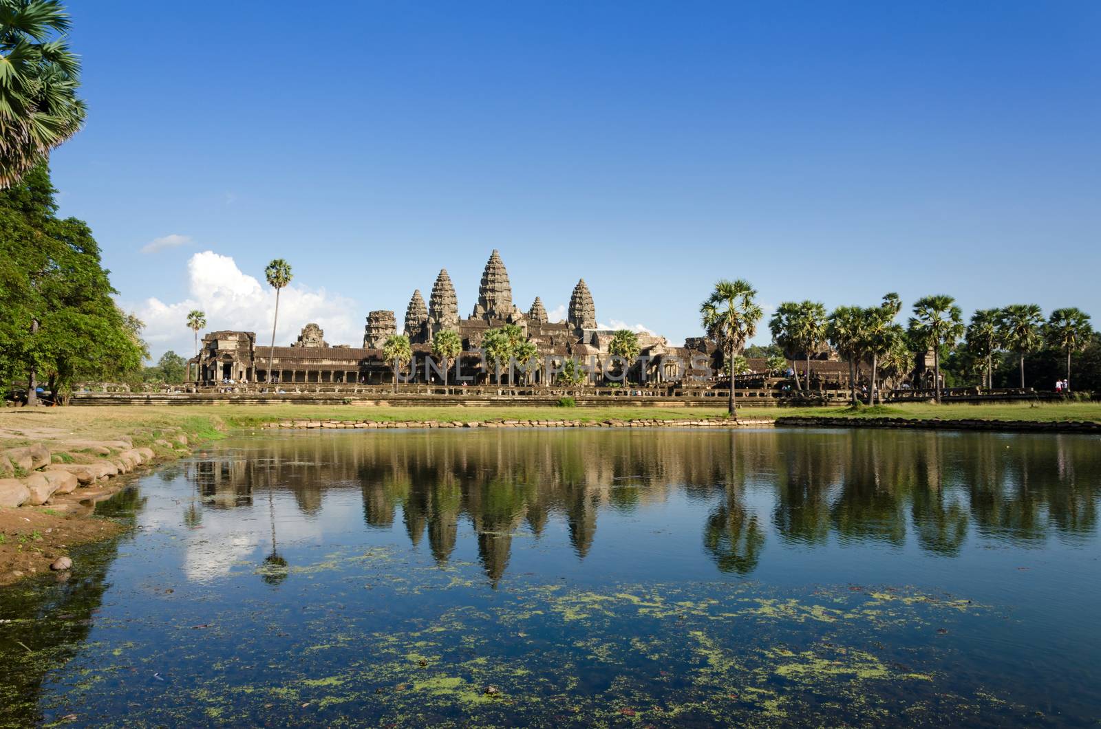 Angkor Wat with reflection in water by siraanamwong