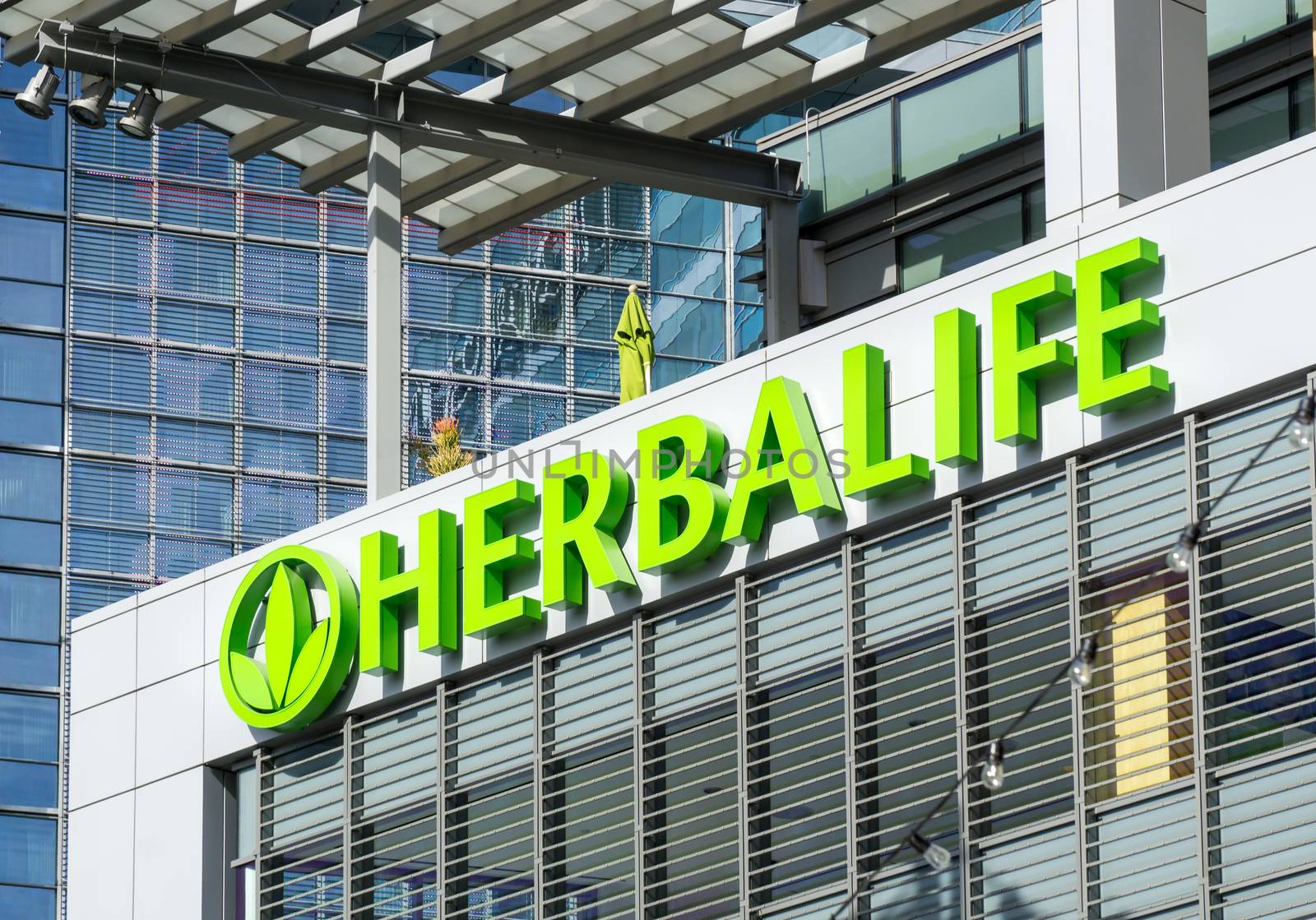 LOS ANGELES, CA/USA - December 6, 2015: Herbalife building and logo. Herbalife International is a multi-level marketing company that sells nutrition, weight management and skin-care products.