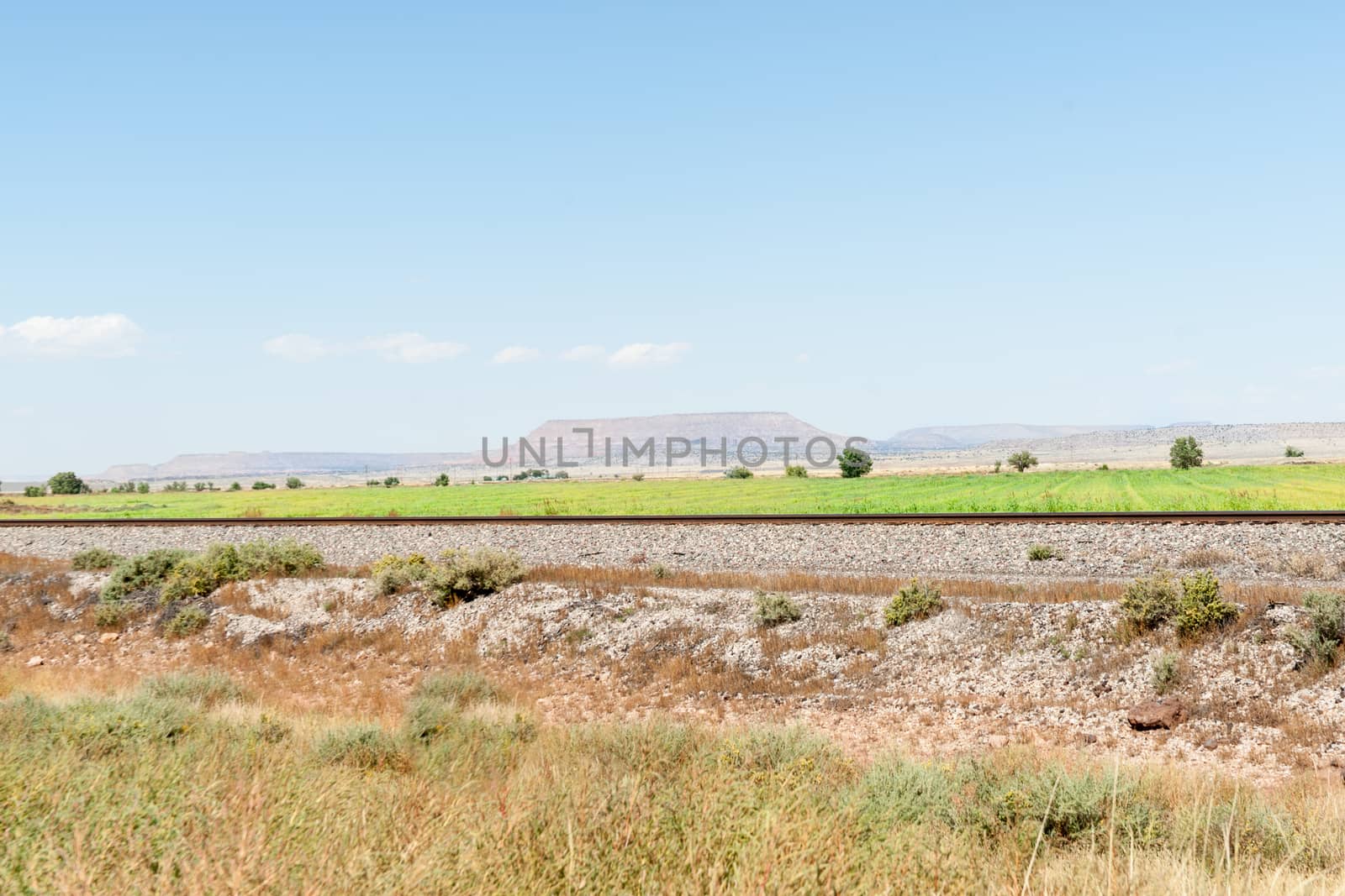 New Mexico high plains landscapes and railway alongside Route 66.