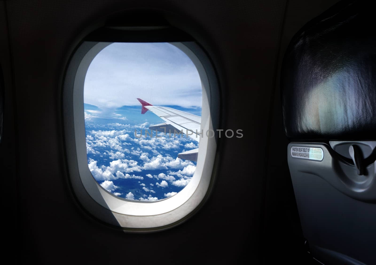 Airplane window seat with view by razihusin