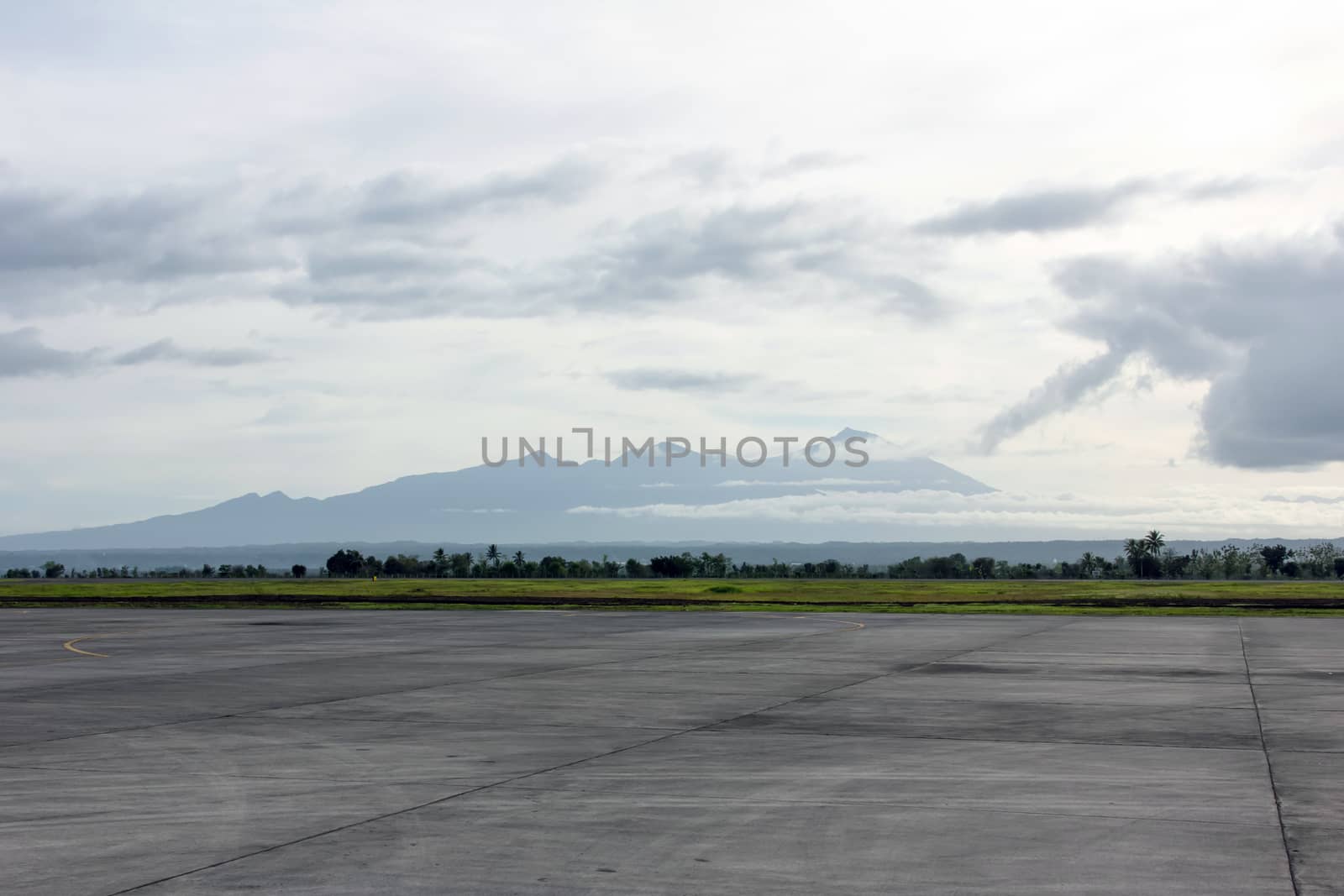 Runway with mountain by liewluck