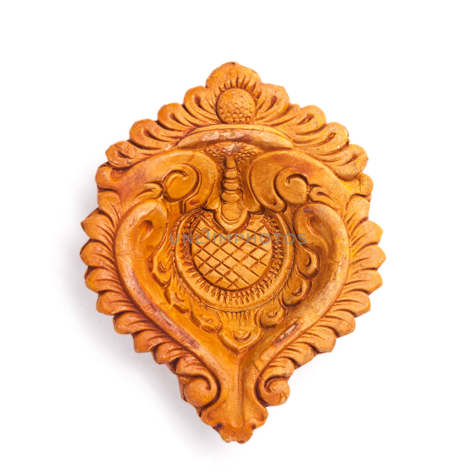 Top view of a beautifully carved designer handmade clay lamp isolated on white background.