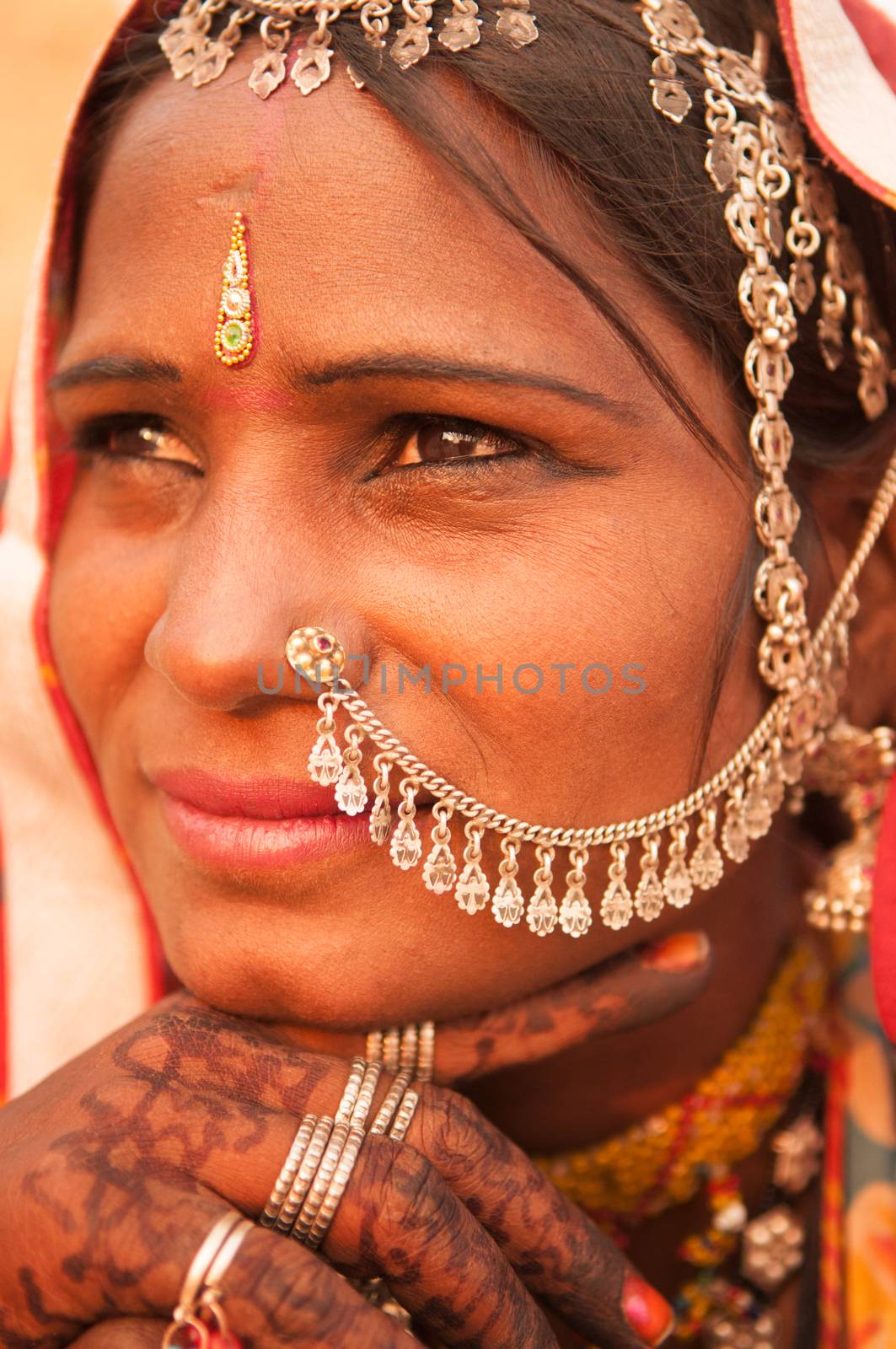 Beautiful Traditional Indian woman in sari costume covered her head with veil, India people