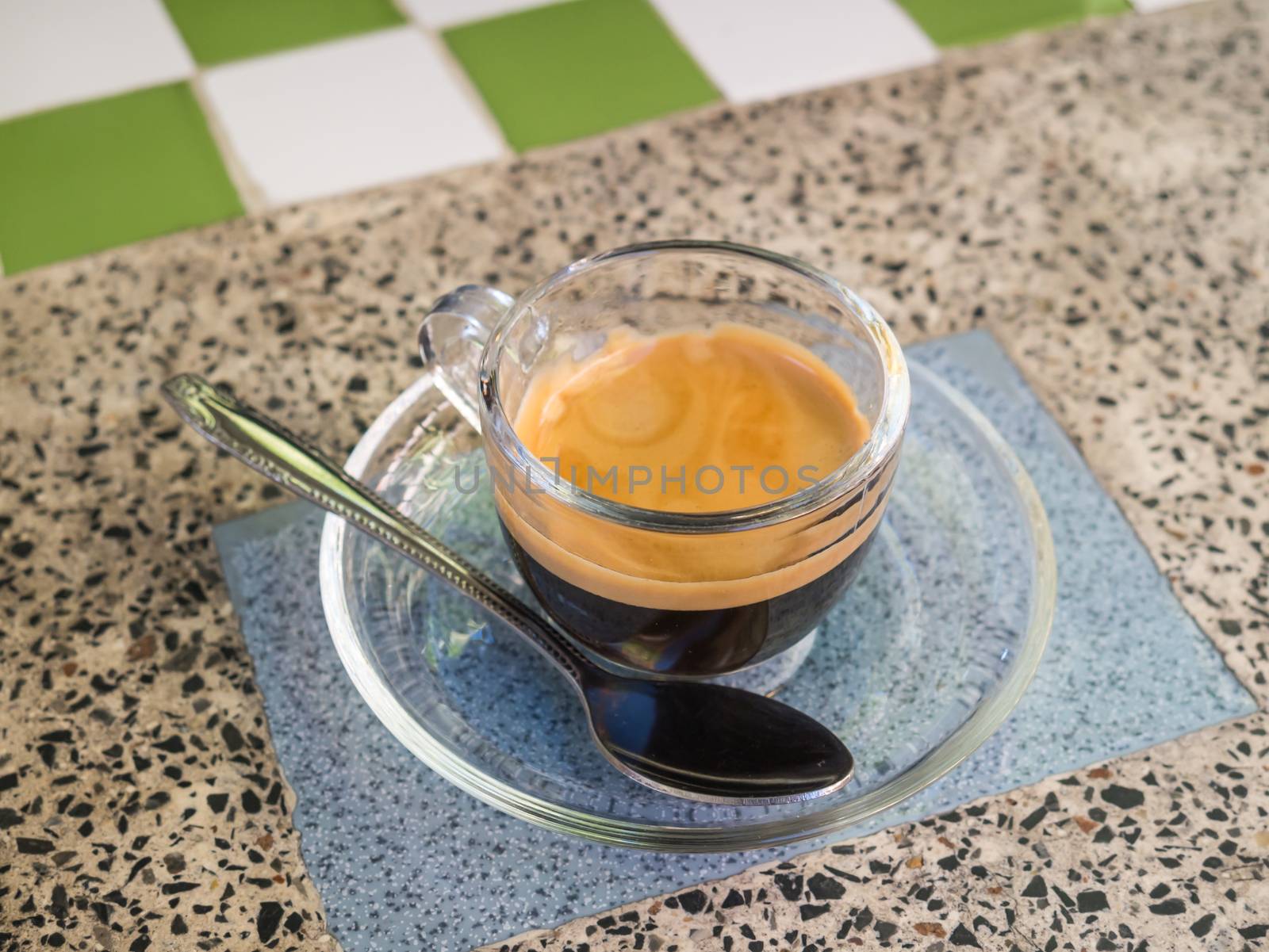 Coffee cup and saucer on table background.