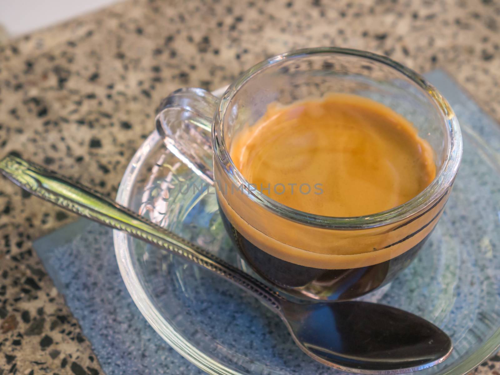 Coffee cup and saucer on table background.