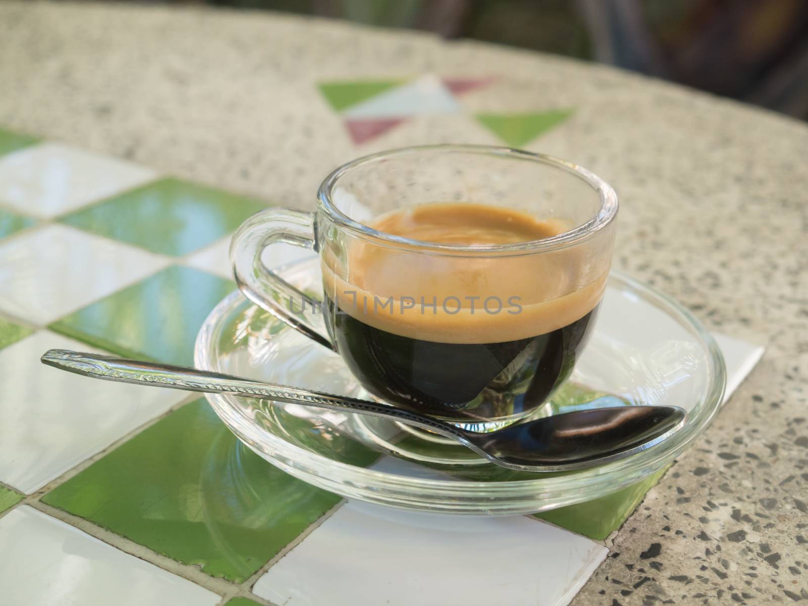 Coffee cup and saucer on table background.