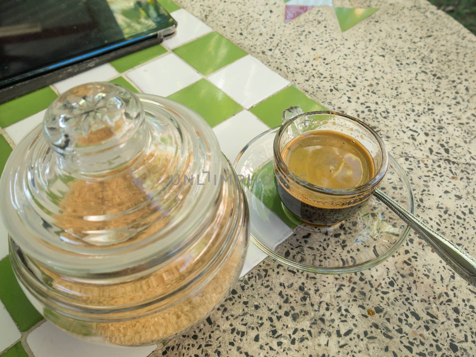 Coffee cup and saucer on table background.