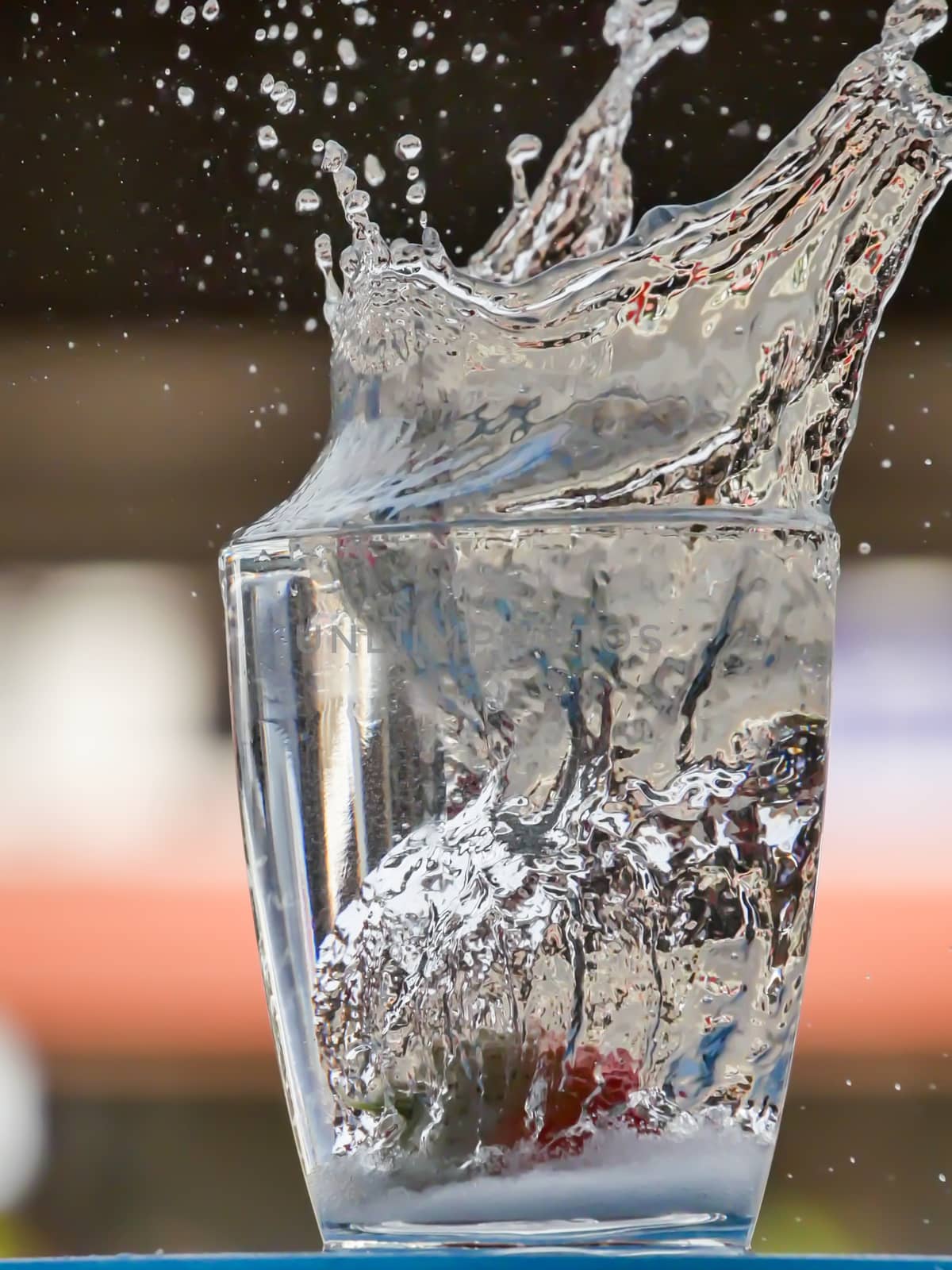 Strawberry Water splash in glass by nikky1972