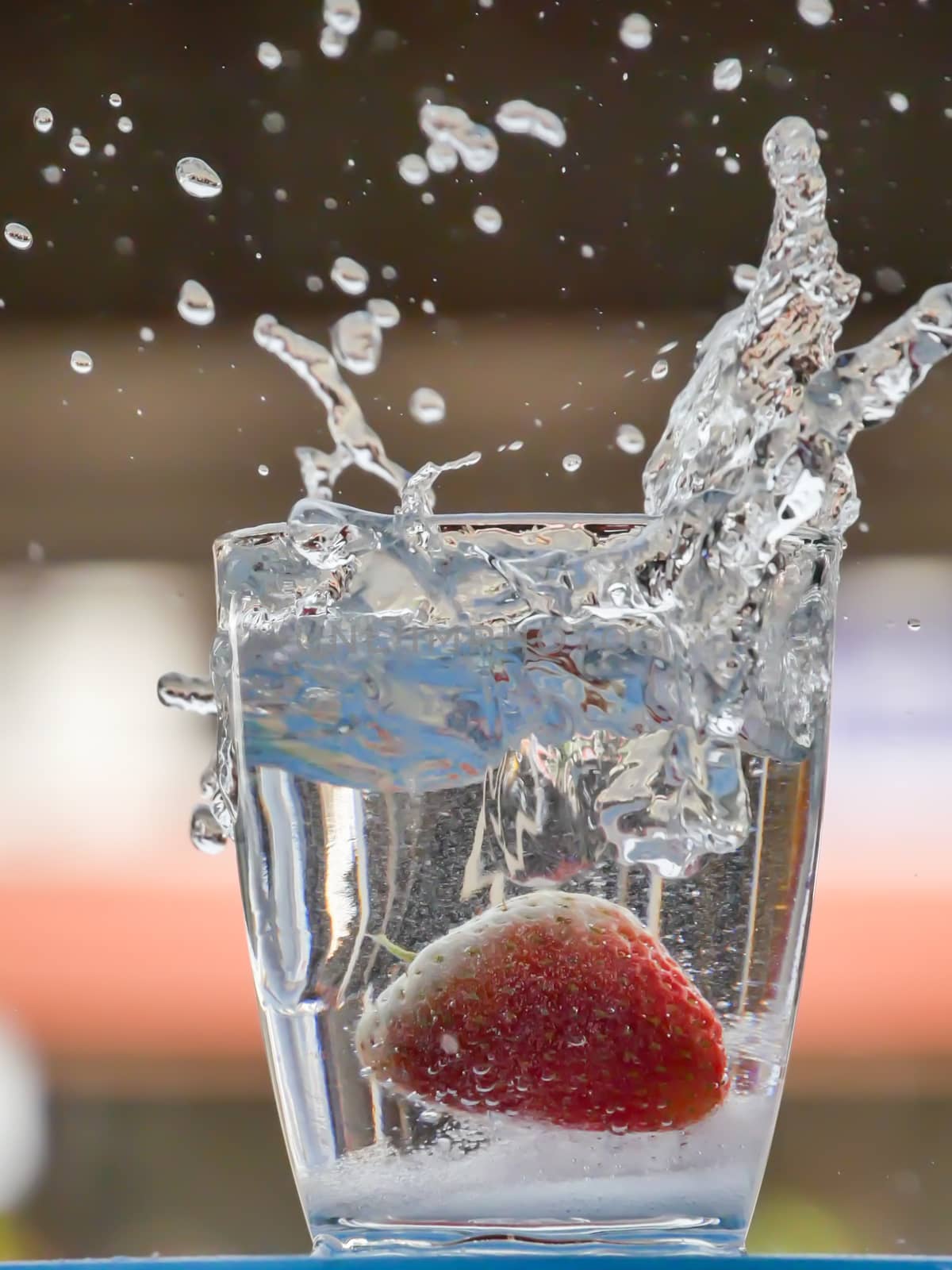 Strawberry Water splash in glass by nikky1972