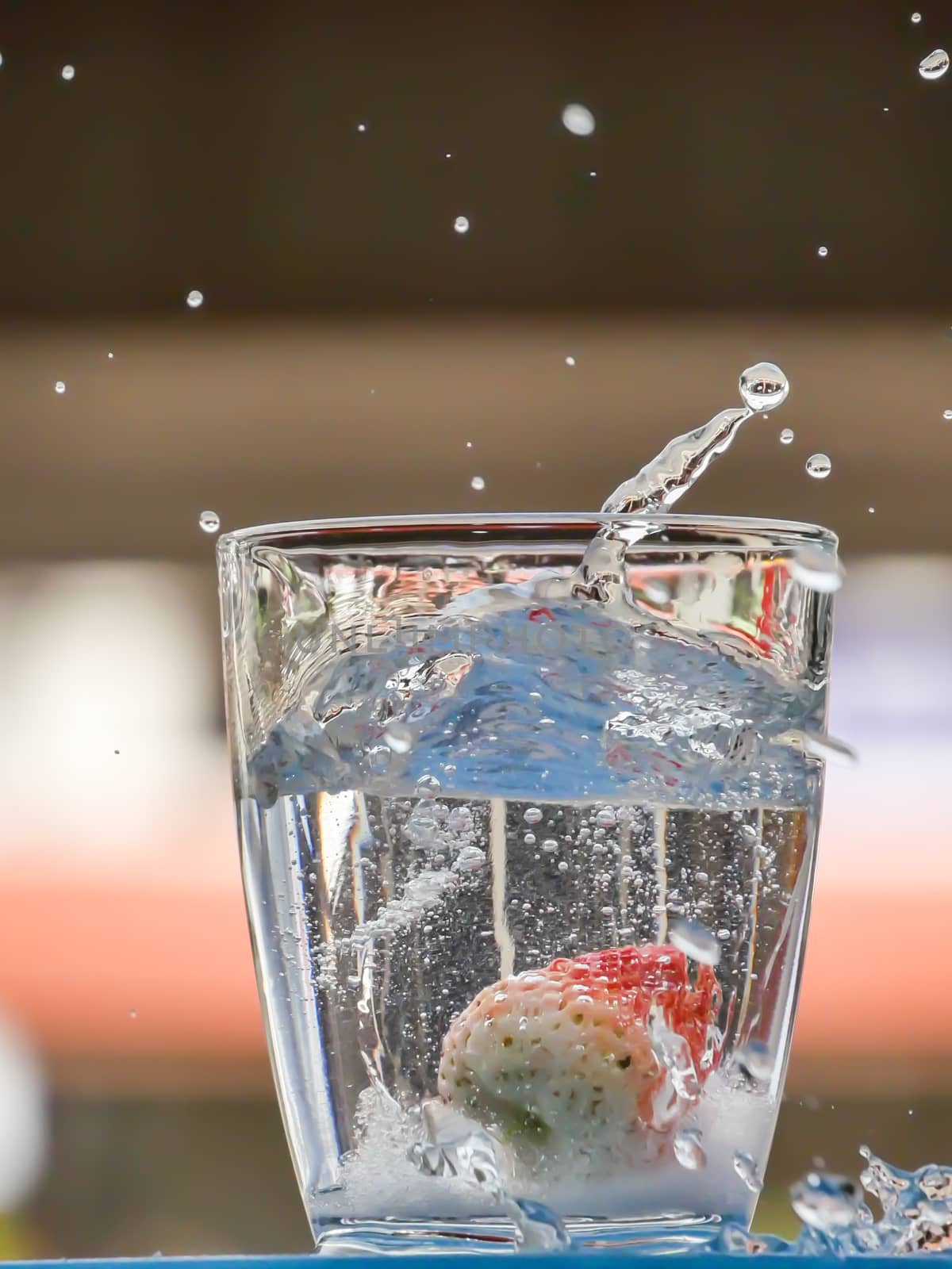 Strawberry Water splash in glass by nikky1972