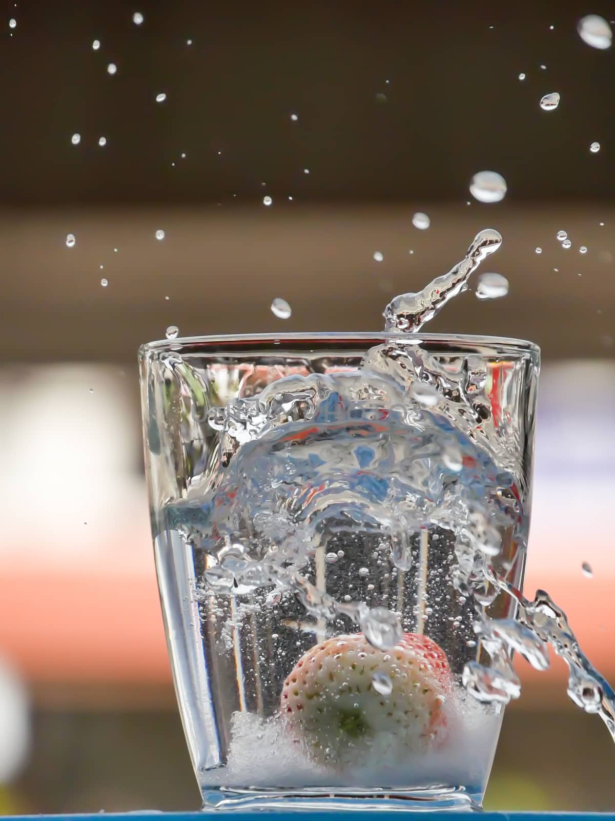 Strawberry Water splash in glass by nikky1972